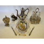 A Victorian electroplated cruet set with cut glass bottles, to/a a Continental cup and cover,