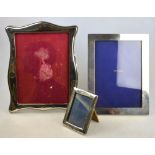 Three silver photograph frames