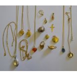 A quantity of 9ct yellow metal and other items including two lockets, necklace chains, teapot charm,