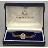 A boxed Certina lady's wristwatch, the silvered dial with gilt batons and hands,