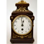 A 19th century German, stained mahogany, small mantle clock with gilt brass mounts,