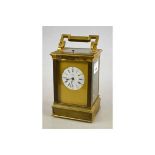 A late 19th century lacquered brass repeating carriage clock,