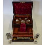 An early 19th century brass bound rosewood travelling toilet case, fitted with two lift-out trays of