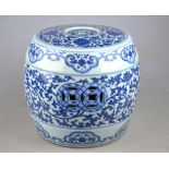 A Chinese blue and white small barrel garden seat decorated with a continuous floral and foliate