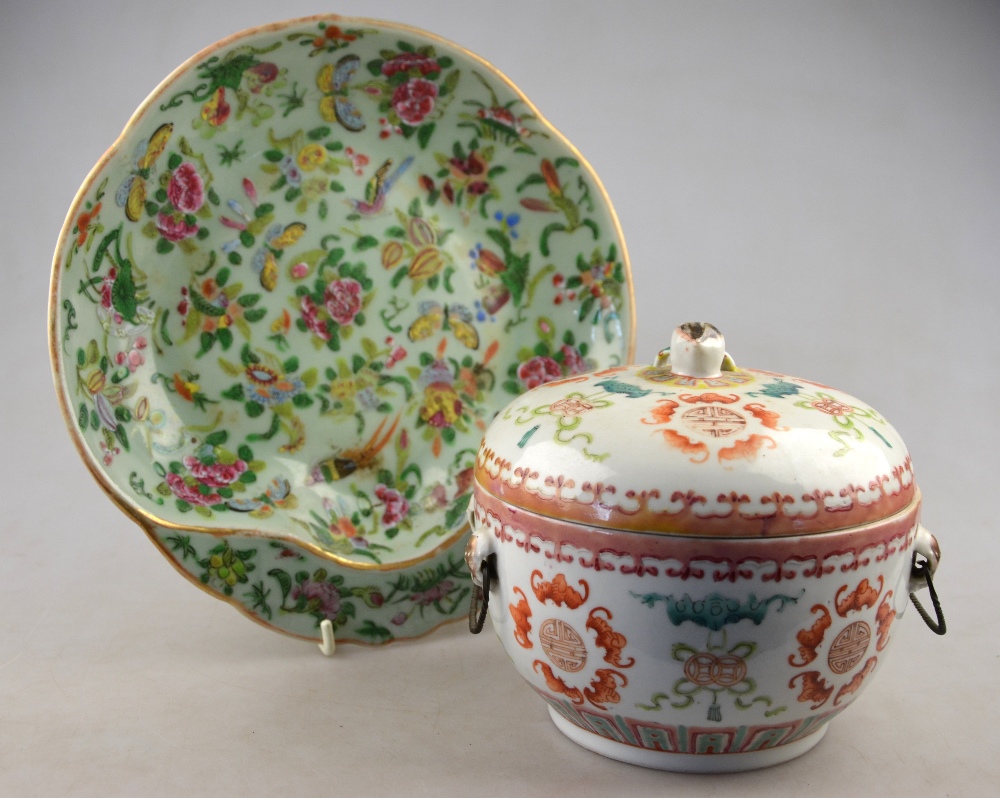 A Chinese 19th century famille rose bowl and cover with two wire loop handles, decorated with bats