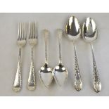 An Edwardian silver set of flatware engraved with trailing foliage,