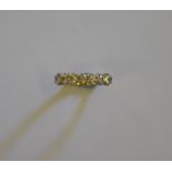 An 18ct yellow gold seven stone brilliant cut diamond ring,