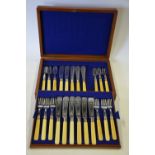 A mahogany cased part-set of fish knives and forks with silver ferrules,