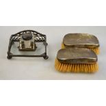 An Edwardian silver and glass ink stand with pierced gallery and square bottles,