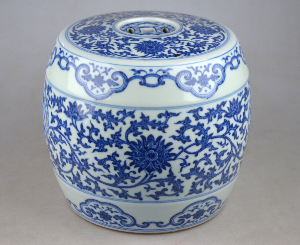 A Chinese blue and white small barrel garden seat decorated with a continuous floral and foliate - Image 2 of 5