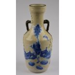 A Chinese 19th century blue and white vase moulded with prunus and decorated with Li Ti Guei on a