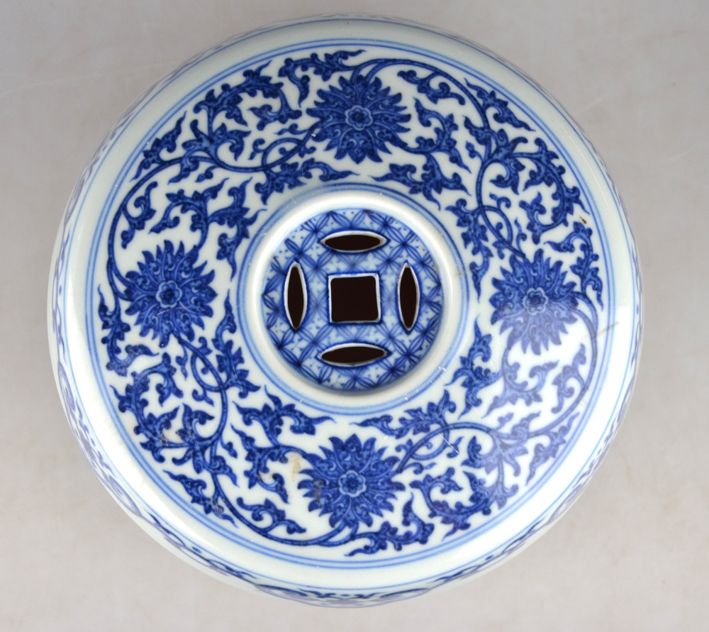 A Chinese blue and white small barrel garden seat decorated with a continuous floral and foliate - Image 4 of 5