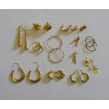 A quantity of gold and yellow metal earrings for pierced ears including hoops, creoles, knots etc,