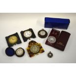 A 19th century gilt metal pocket compass with silvered dial, in American cloth outer case,