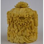 A 19th century Chinese Canton ivory oval pot and cover carved with chrysanthemums and other flowers,