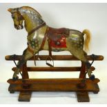 An antique wooden child's rocking horse in original unrestored condition, prob by F Ayres, having