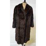 A dark brown Russian squirrel full-length coat retailed by Frances Furs, Epsom, 50 cm across