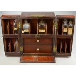 An early 19th century mahogany travelling apothecary's box, fitted with shelves,