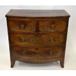 A Victorian mahogany bowfront chest of two short over two long graduated drawers raised over a