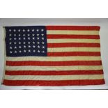 Two American stars and stripes linen flags, each with 48 stars circa 1940's,