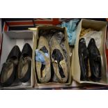 Three pairs of 1920's lady's shoes comprising; a black leather pair, a floral fabric pair and a
