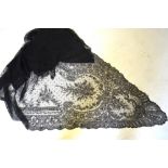 Two black lace shawls, a black lace stole, a black needle-run lace mantilla, two black lace collars,