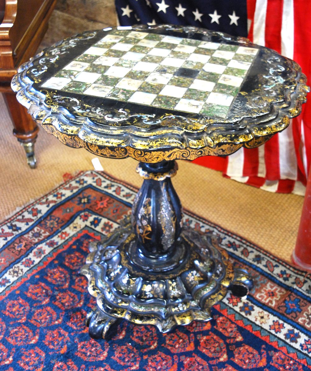 A Victorian mother-of-pearl and gilt decorated papier mache games table,