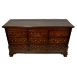 An 18th century oak mule chest,