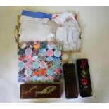 A box and shallow wicker layette tray containing assorted table linen to include tablecloths,