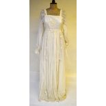 A 1970's ivory white peasant-style maxi-dress with lace bib to front and ribbon and lace suspended