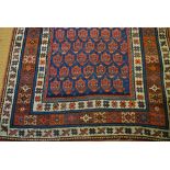 An antique Caucasian runner, the field of stylised repeating botehs on mid blue ground, 2.86 x 1.