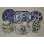 A Chinese 18th century blue and white chamfered meat dish decorated with flowers, buildings and pine