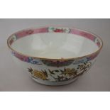 A Chinese 18th century famille rose bowl decorated with deer, flowers and foliage, Qianlong, 25 cm