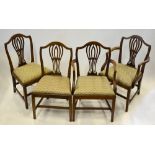 A set of eight 19th century mahogany dining chairs in the Hepplewhite style having pierced vertical