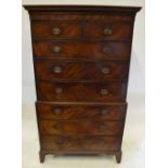 A George III mahogany chest on chest having a shaped cornice over two short and six long graduated