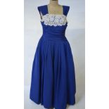 A 1940's Rackhams 'a Harrods store' ribbed royal blue satin evening dress with cream floral and