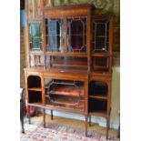 A good quality inlaid rosewood display cabinet in the manner of Edwards & Roberts, the stepped top