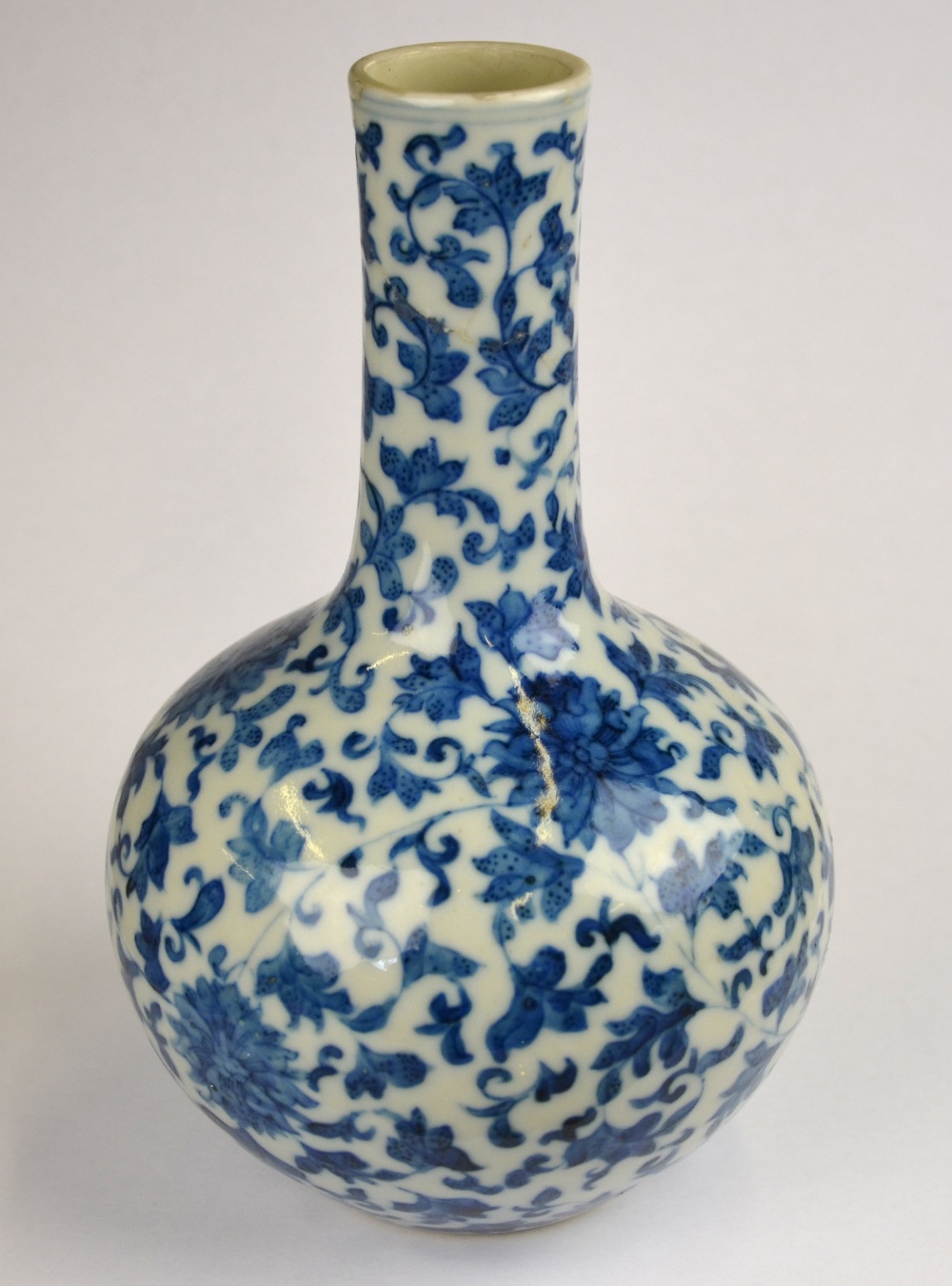 A Chinese blue and white bottle vase decorated with flowers and foliage, Yongzhing seal mark but - Image 4 of 4