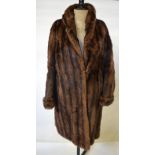 A shadowed musquash fur coat retailed by Marshall & Snelgrove, 50 cm across chest Condition Report