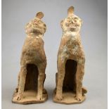 Chinese Tang Dynasty 618-907 AD - Two pottery tomb guardians with traces of cold pigment 26 cm h.