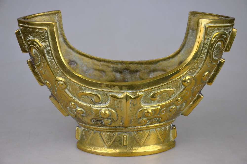 A Chinese brass vessel of archaic form, 20th century, 16.