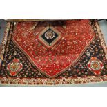 An antique Turkoman rug, the three row gul design on dark red ground, 1.75 x 1.25 m Condition Report