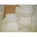 A peach silk quilted bed-cover, sheet with crocheted edging,