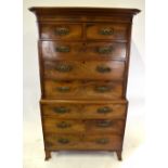 A George III figured mahogany chest on chest, the canted shaped cornice over two short and six