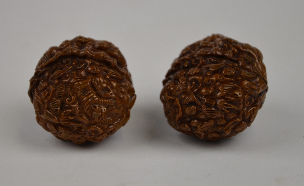 Two Chinese walnuts profusely carved with figures (2) - Image 2 of 5