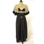 A Victorian full-length black silk taffeta dress, the belt set with crystals, deep cream lace collar