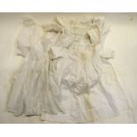 An embroidered silk Christening gown and satin bonnet, a needle-run net baby's gown,