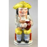 A Victorian Ralf Wood style Toby jug, grey waistcoat, yellow breaches and tricorn hat, 24.5 cm