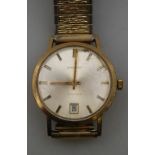 A gentleman's Garrard 9ct gold wristwatch with automatic movement, champagne dial with gilt batons
