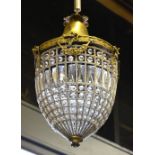 A pair of vintage lacquered brass crystal strung light fittings,
